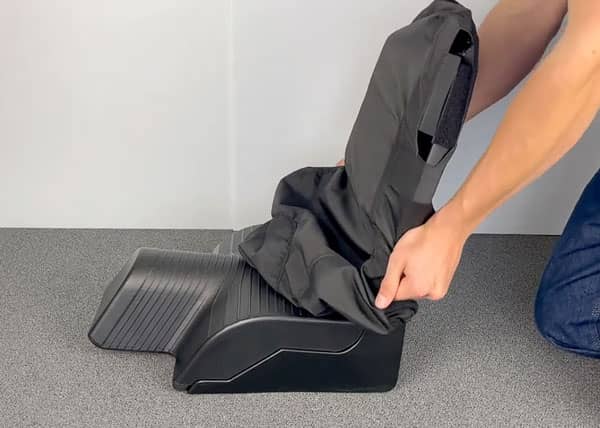 Shark Seating Care & Maintenance - man putting on a seat cover